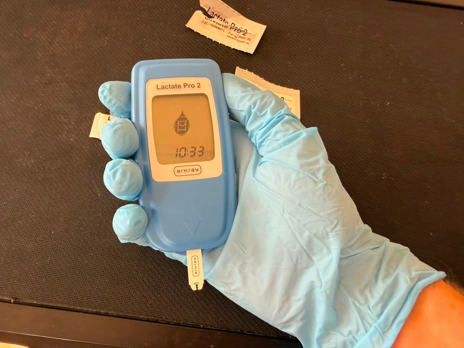 Coach taking a lactate reading from the Lactate Pro 2 meter